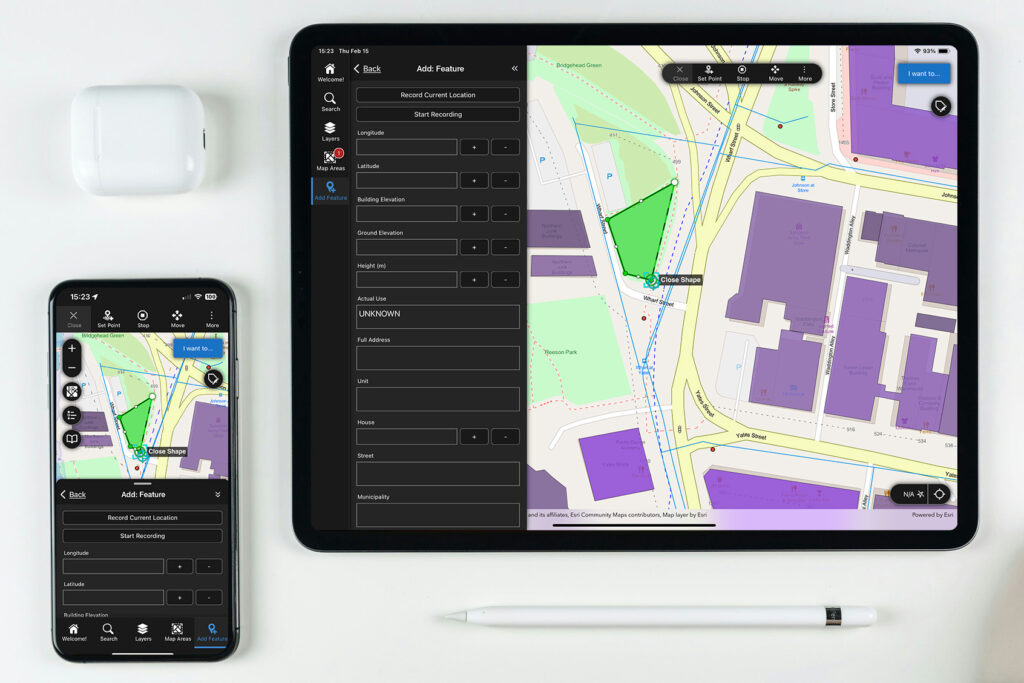 Apple phone and tablet with accessories.