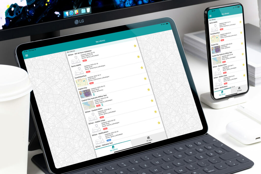 Tablet and phone on a desk running VertiGIS Go
