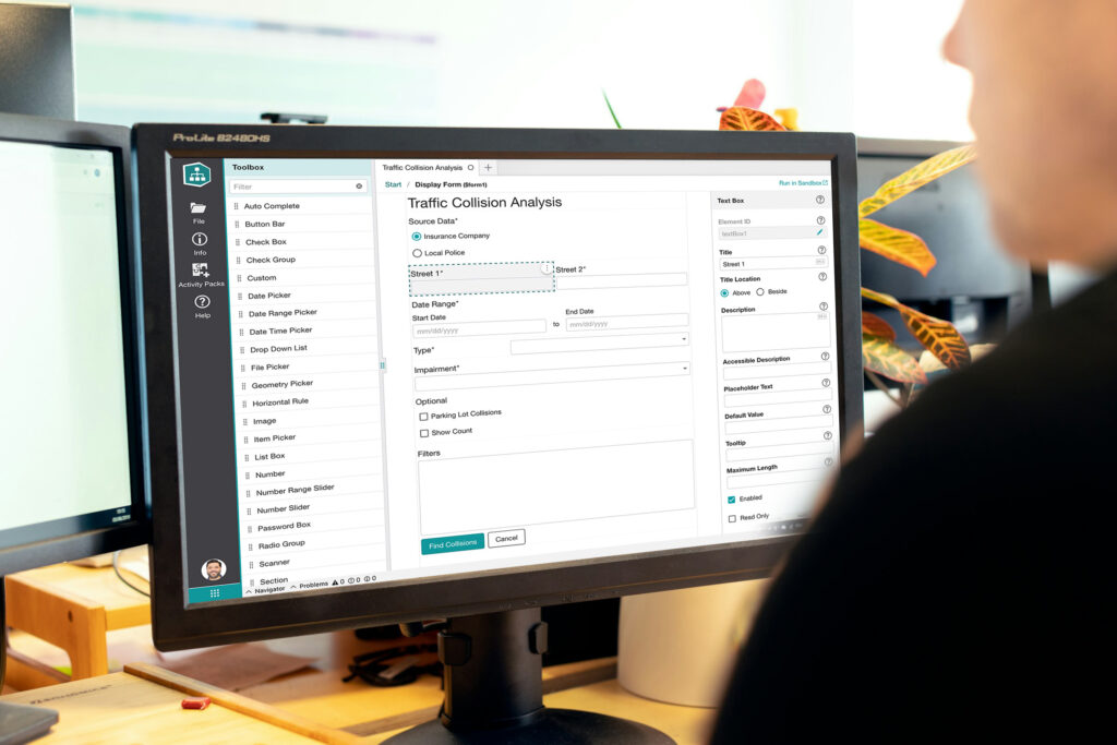 Desktop monitor with form builder app.